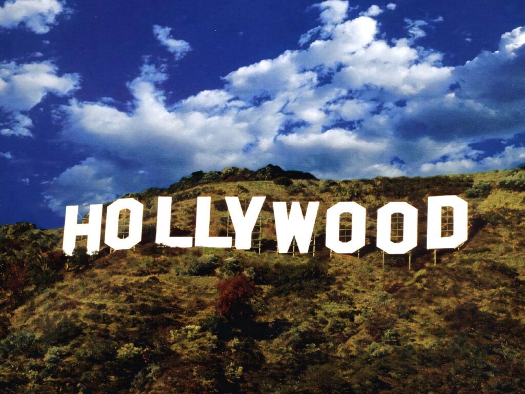 Hollywood Sign Wallpaper: Vibrant Sky Background Art