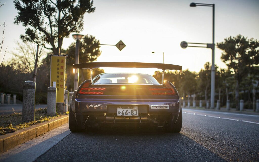 Stunning Honda NSX Wallpaper: Rear View with Scenic Sunset Background