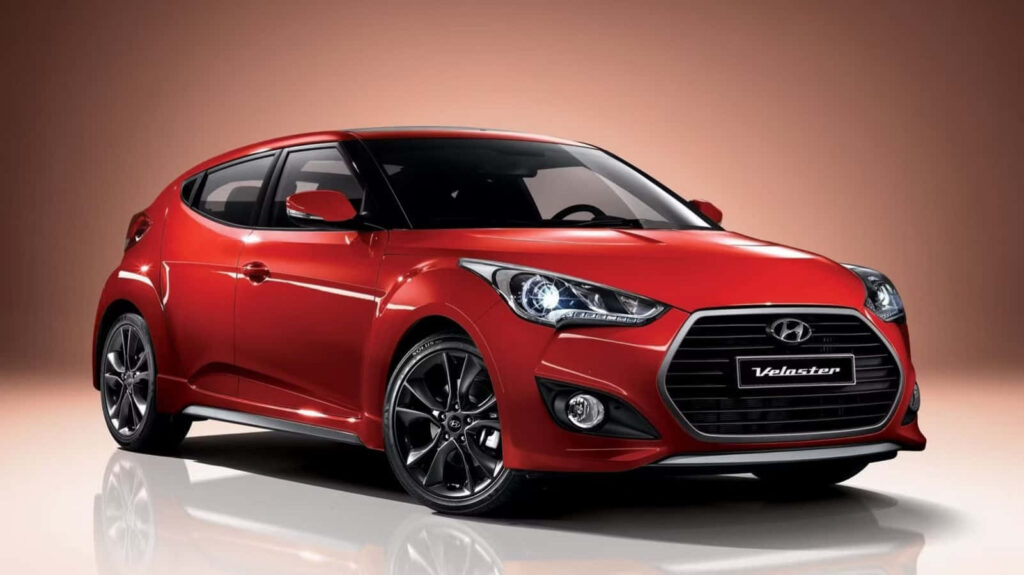 Vibrant Red Hyundai Veloster Wallpaper - Sleek Design Background