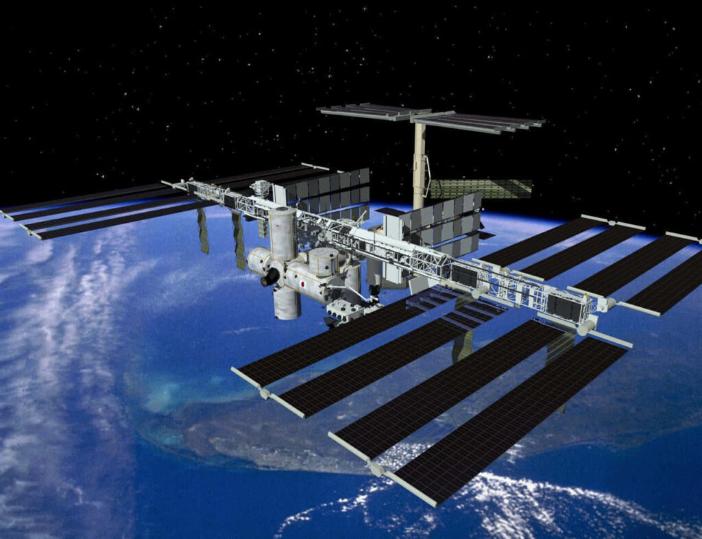 Astronaut Working on ISS: Stunning Wallpaper of Earth and Space