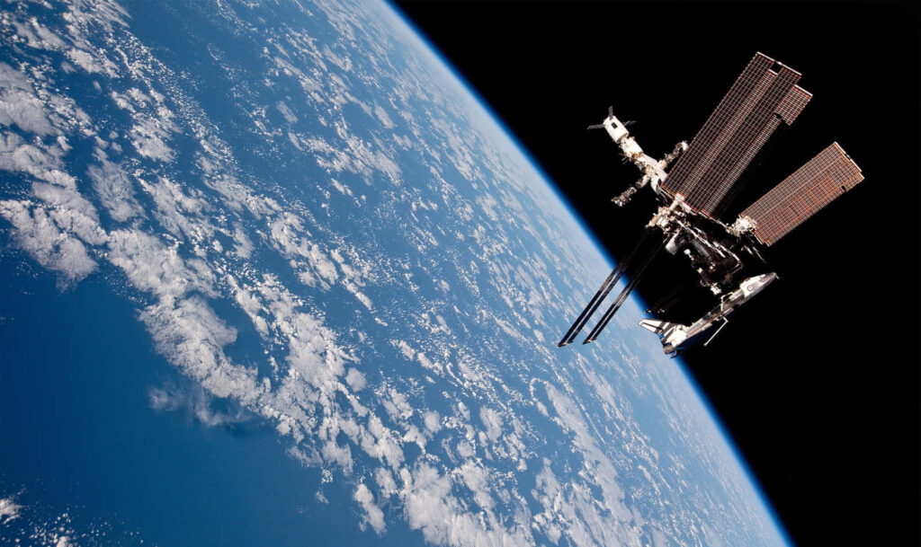 Stunning ISS Wallpaper: Earth’s Blue Hues and Clouds in Space