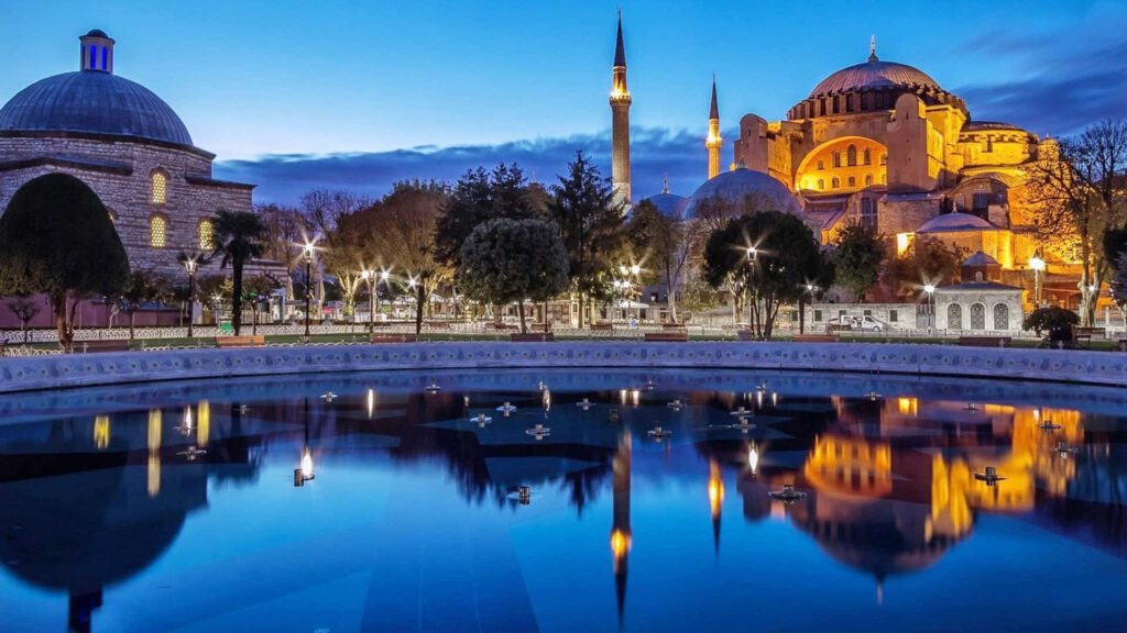 Stunning Istanbul Evening: Hagia Sophia Reflection in Serene Pool Wallpaper