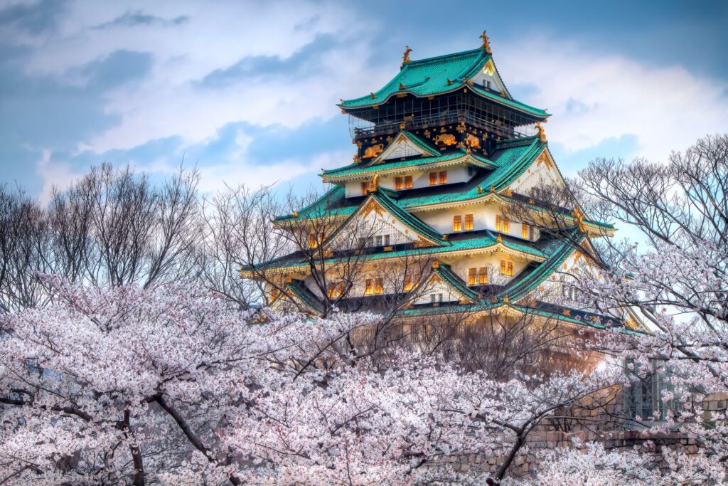 Stunning Japanese Castle Wallpaper with Cherry Blossoms in Spring