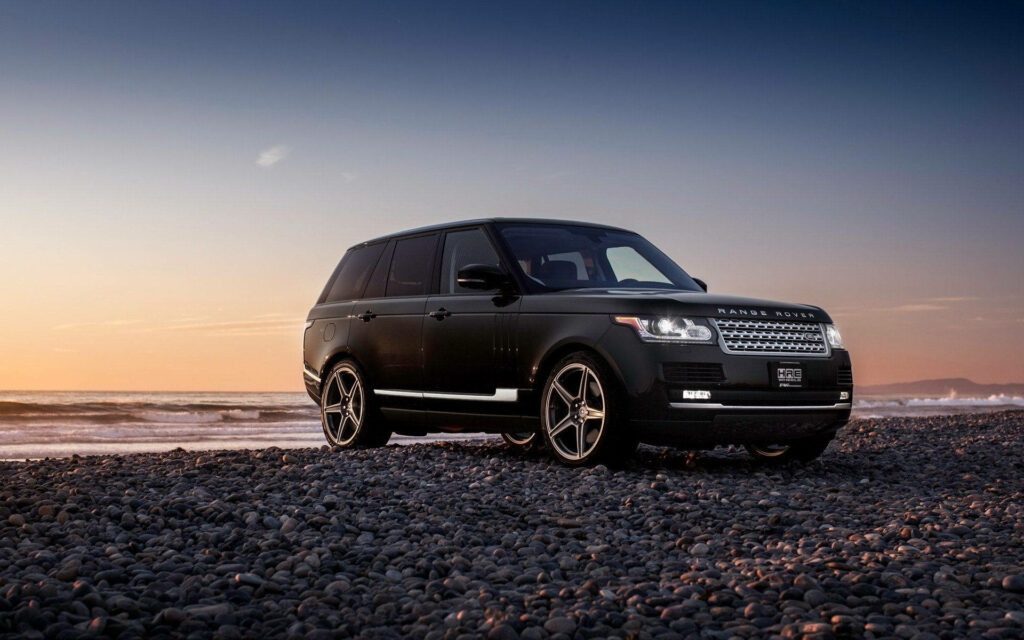 Stunning Jet Black Range Rover Wallpaper: Luxury Meets Nature