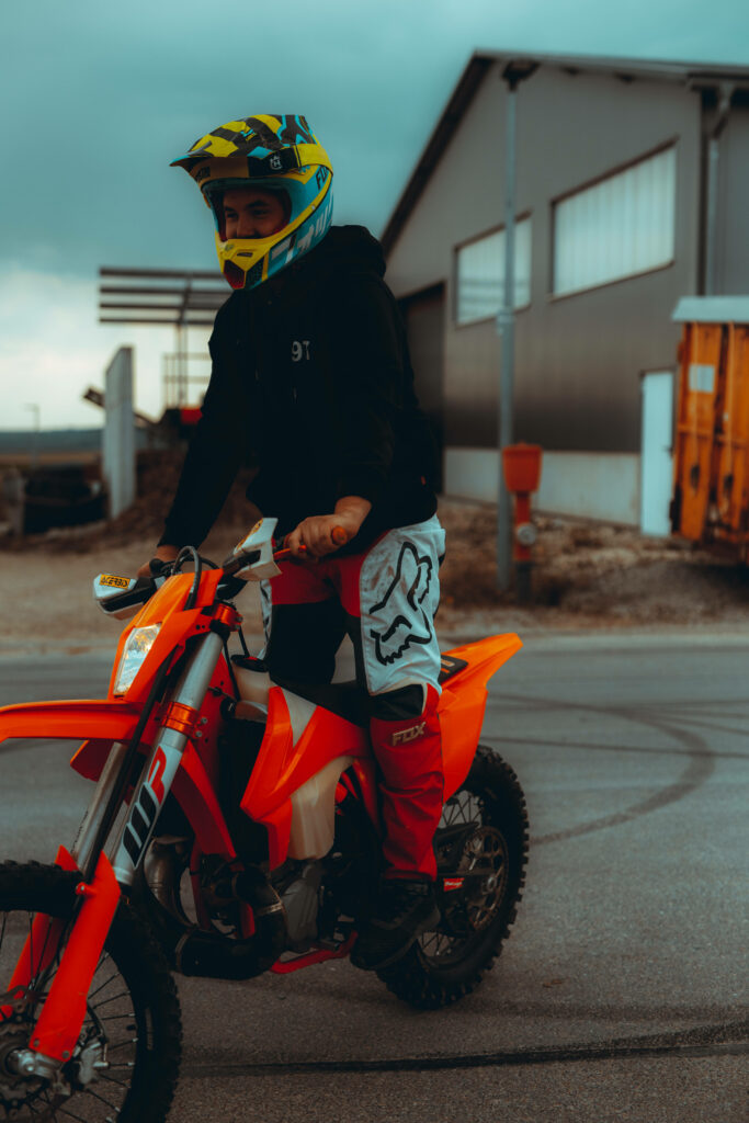 KTM Bike Rider Outdoor Wallpaper: Vibrant Gear & Tire Marks