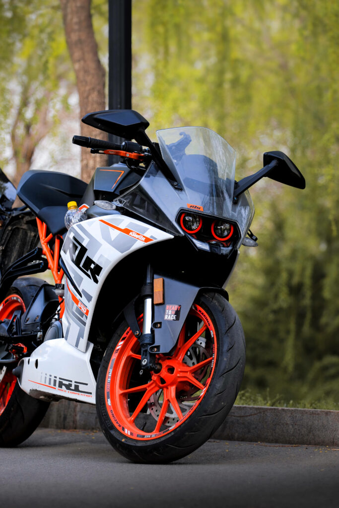 Stunning KTM RC 390 Wallpaper: Orange Wheels & Sporty Design