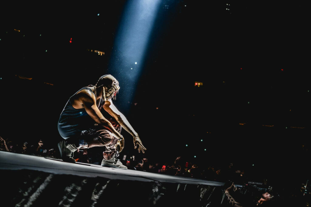 Kanye West Masked Performance Wallpaper - Dynamic Stage Background