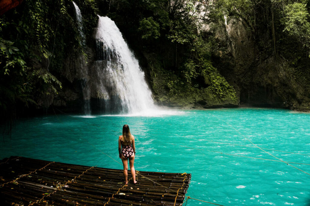 Serene Kawasan Waterfalls Wallpaper: Turquoise Lagoon & Lush Greenery