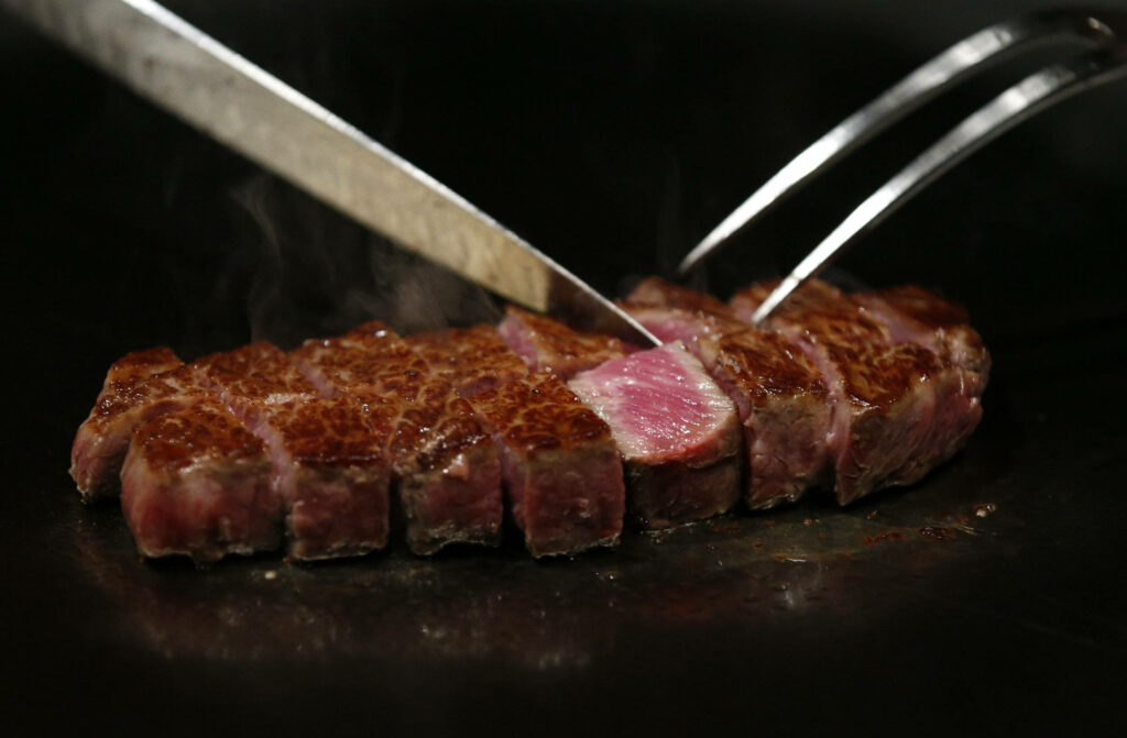 Stunning Medium-Rare Kobe Beef Steak Wallpaper Background