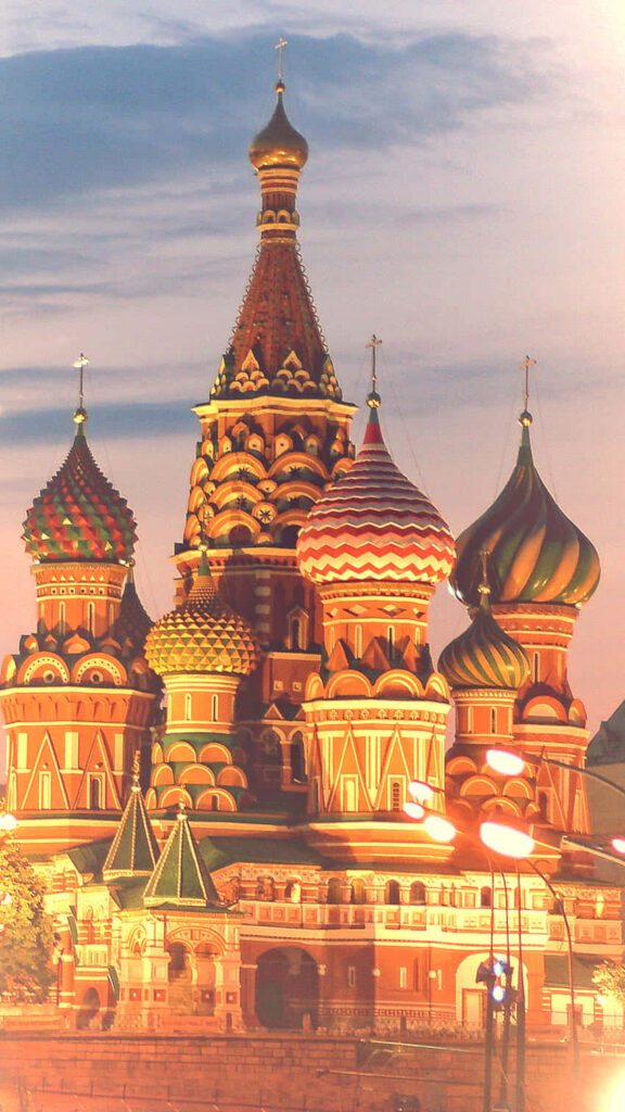 Portrait view of colorful Kremlin Moscow architecture with intricate details and soft sky background Wallpaper