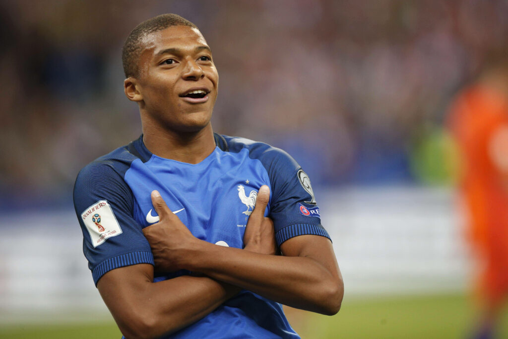 Dynamic Wallpaper of Kylian Mbappe Celebrating in France Jersey