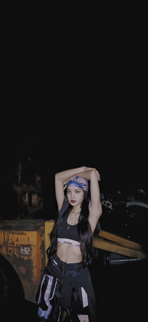 Stylish Lalisa Manoban Nighttime Wallpaper - Confident Pose & Design