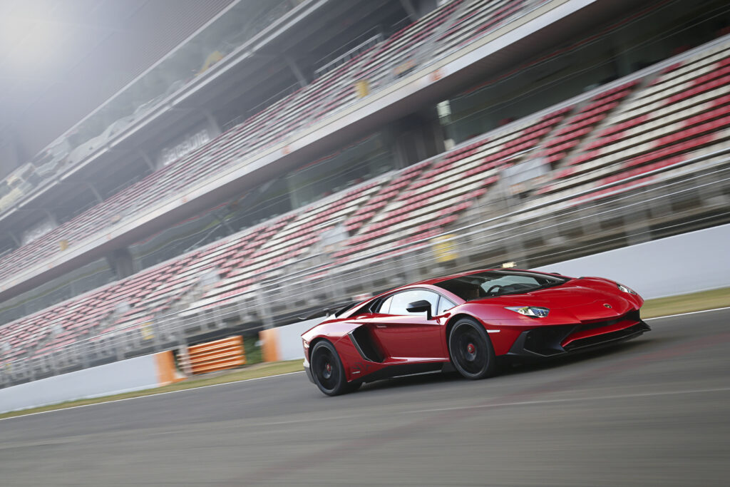 Stunning Red Lamborghini Aventador LP 750-4 on Race Track Wallpaper