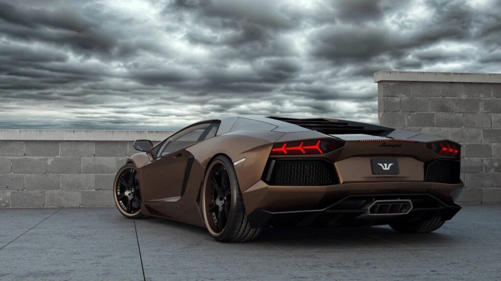 Sleek Lamborghini on Rooftop: Dramatic City Skyline Wallpaper