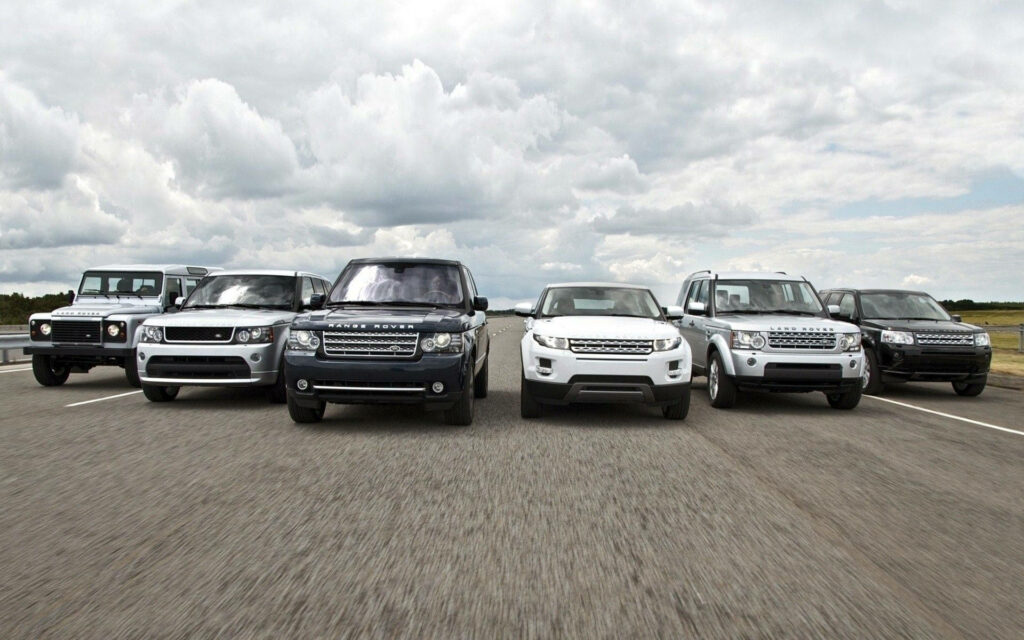 Stunning Land Rover Lineup: Rugged Elegance Wallpaper Background