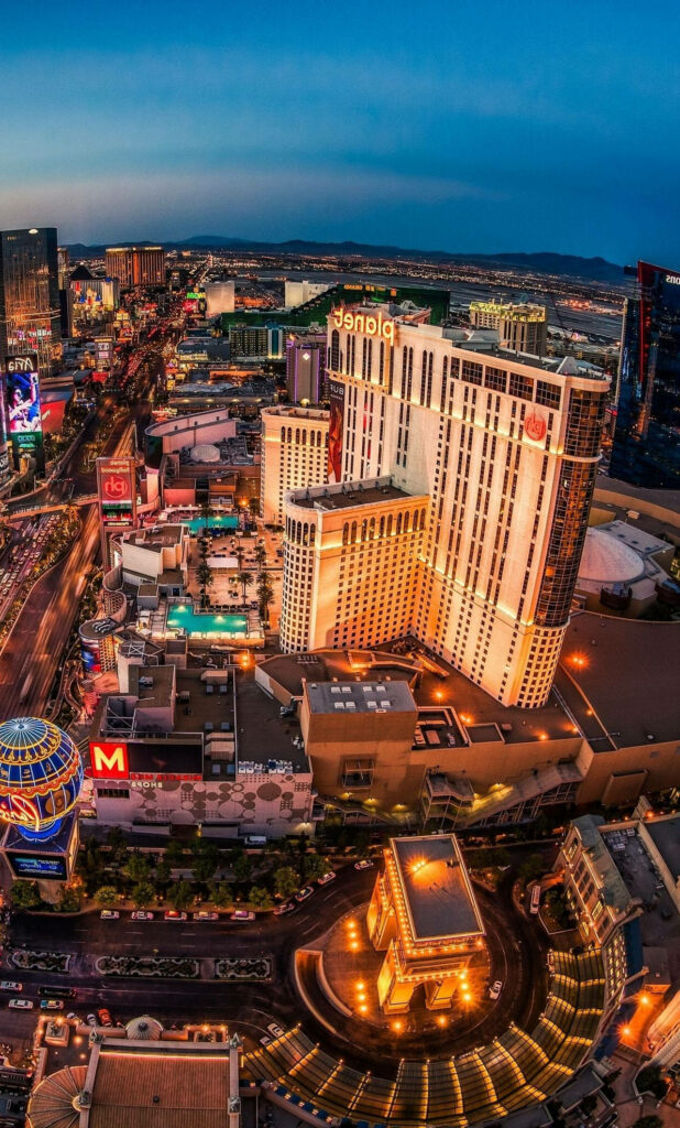 Twilight Las Vegas Aerial: Vibrant City Lights Wallpaper Background