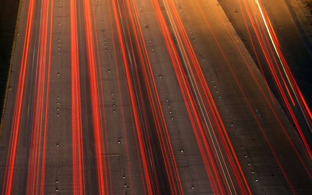 Vibrant Long-Exposure Highway Wallpaper: Red & Yellow Light Trails