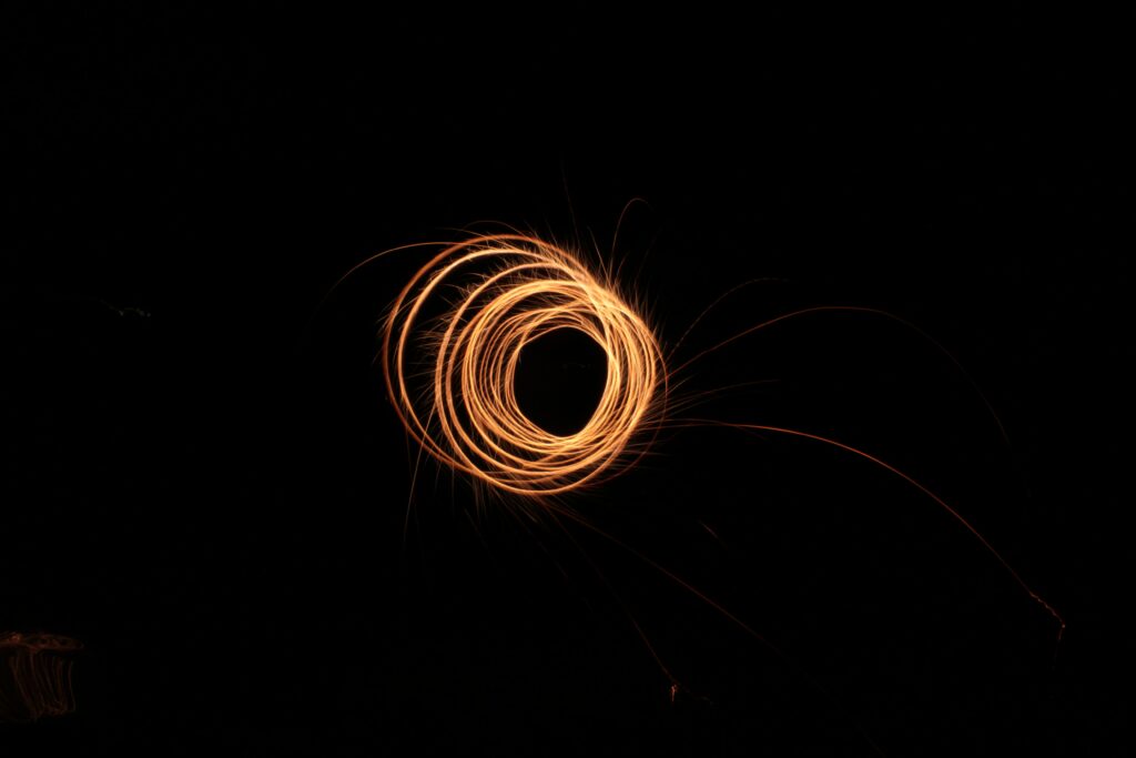 Glowing Circular Light Trails - Artistic Long-Exposure Wallpaper