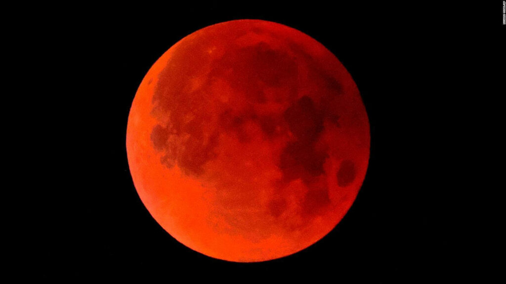 Lunar Eclipse Wallpaper: Stunning Red Moon in Dark Space Background