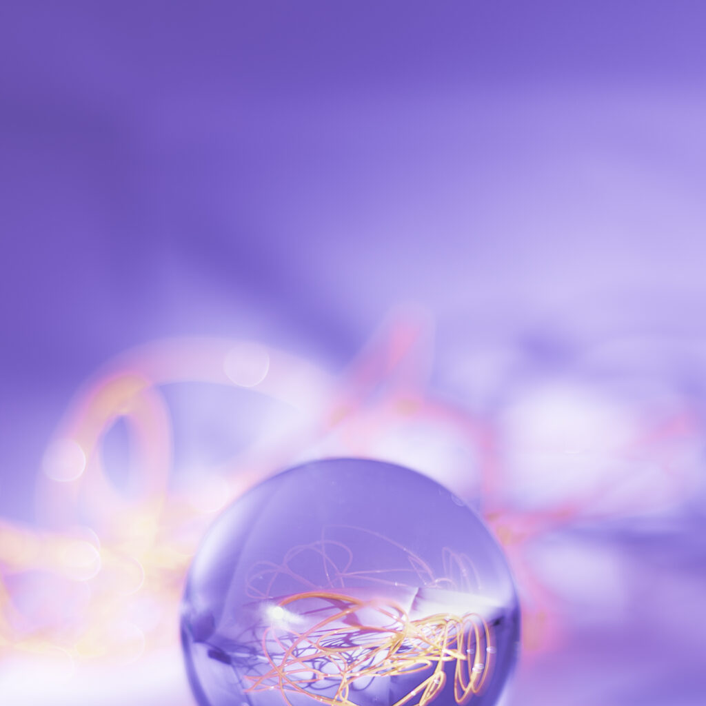 Dreamy Crystal Ball Macro with Vibrant Purple Wallpaper Background