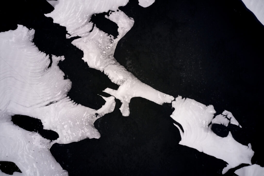Stunning Macro Ice & Snow Formations Wallpaper Against Dark Backdrop