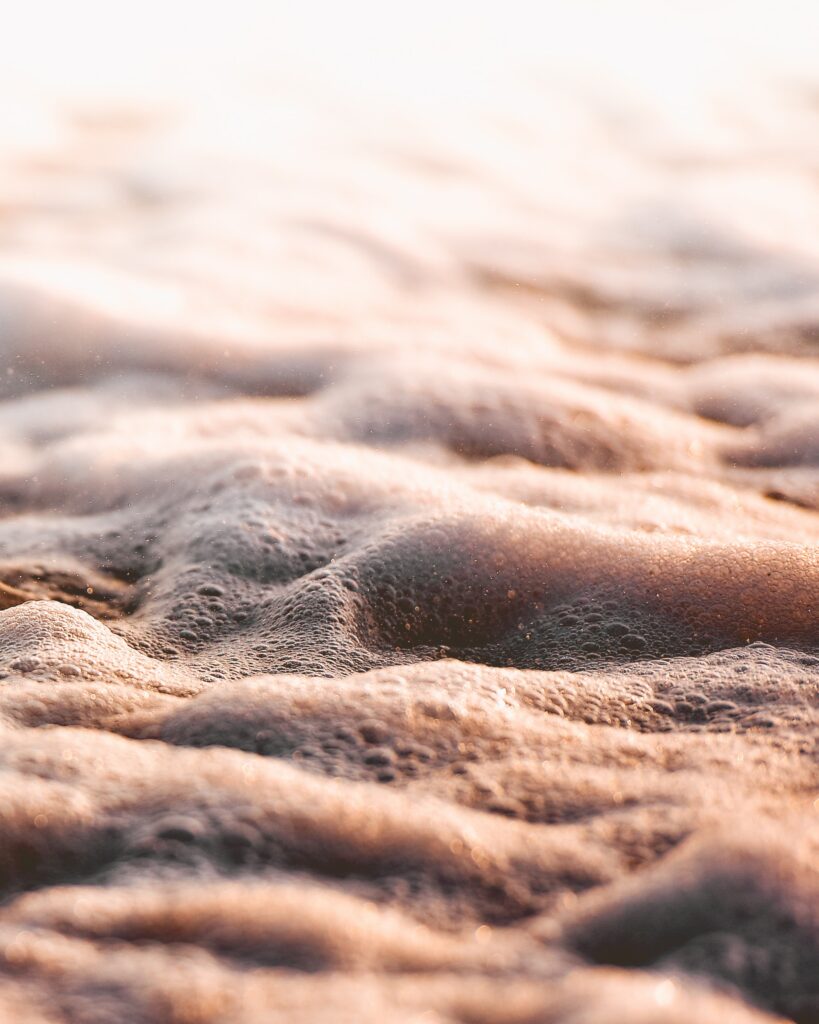 Intricate Ocean Wave Macro: Textured Foam & Soft Lighting Wallpaper