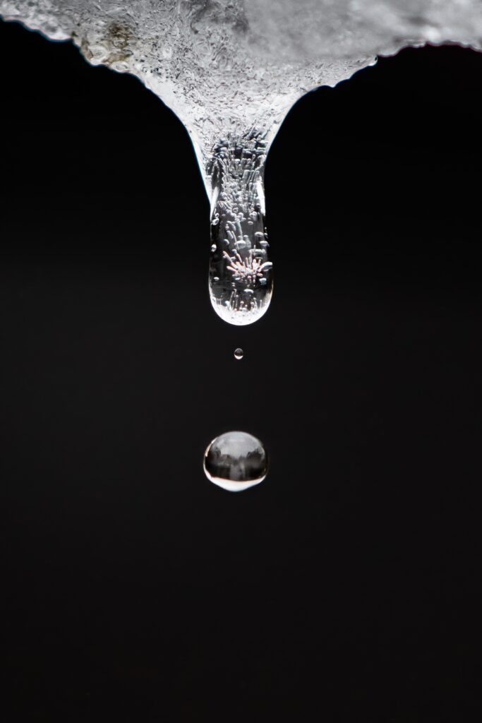 Stunning Macro Photo: Transparent Water Drop on Black Wallpaper