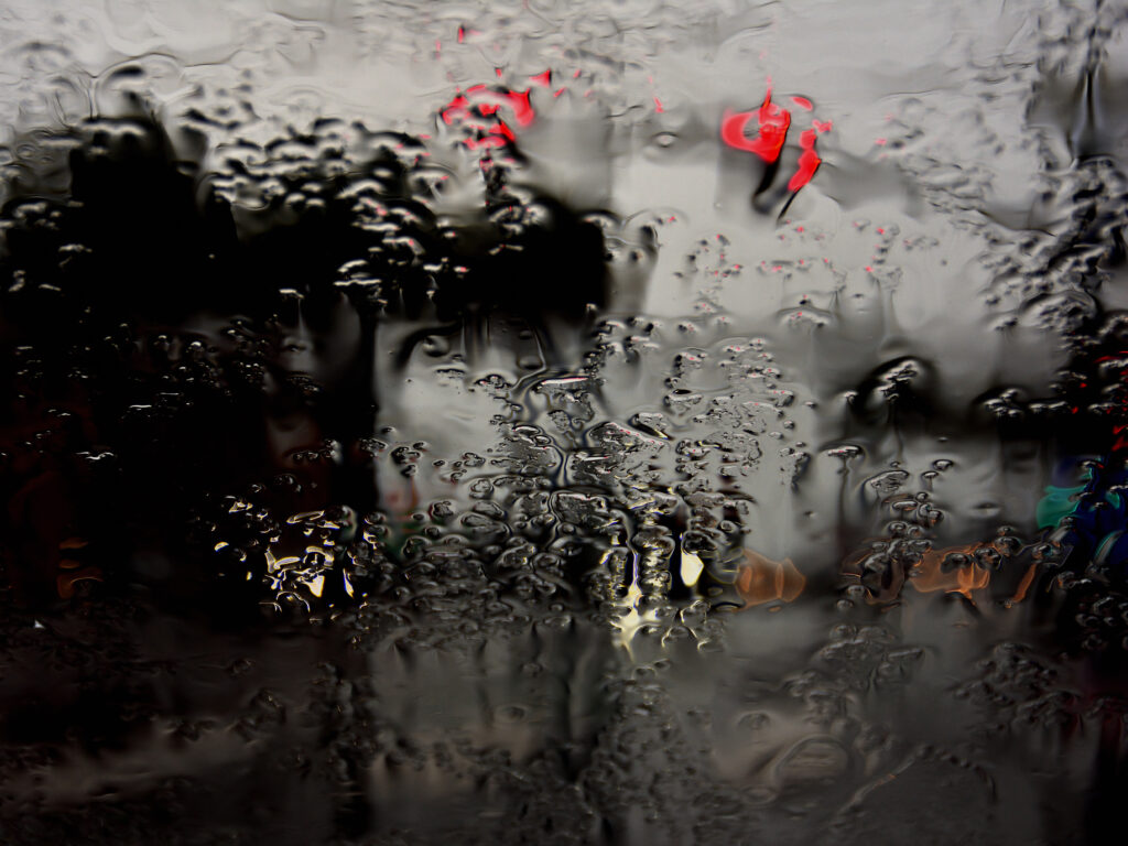 Intricate Rain Droplets on Glass - Moody Wallpaper Background