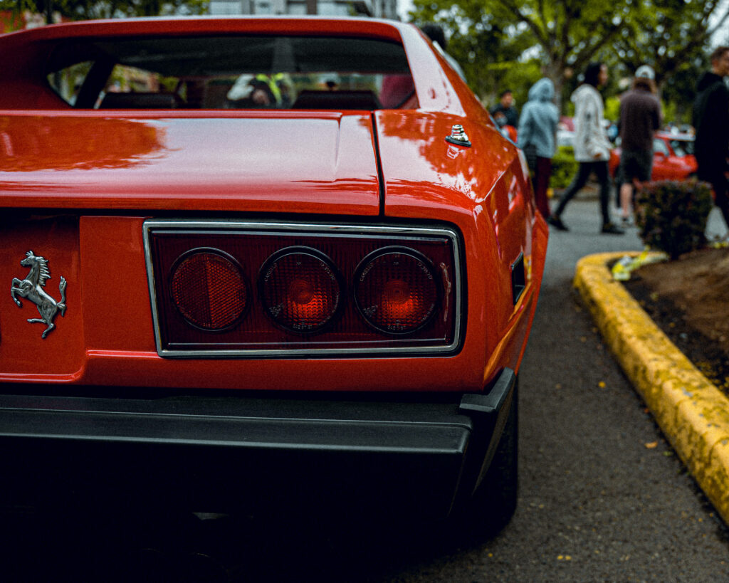 Magnificent Macro Shot Revealing the Mesmerizing Rear Lights of a 4K Ferrari Dino 308 in Radiant Orange Wallpaper