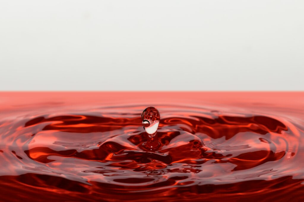 Stunning Red Liquid Drop Splash - Macro Wallpaper Background