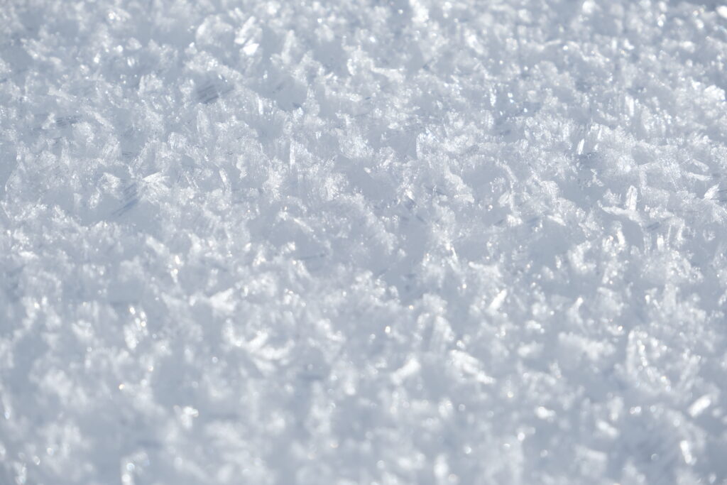 Intricate Frosty Snow Crystals: Macro Wallpaper Background