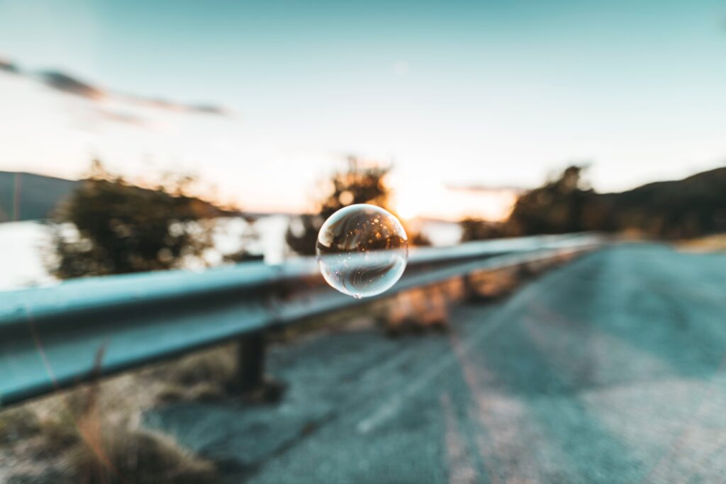 Stunning Soap Bubble Macro Shot: Nature Reflections at Sunset Wallpaper