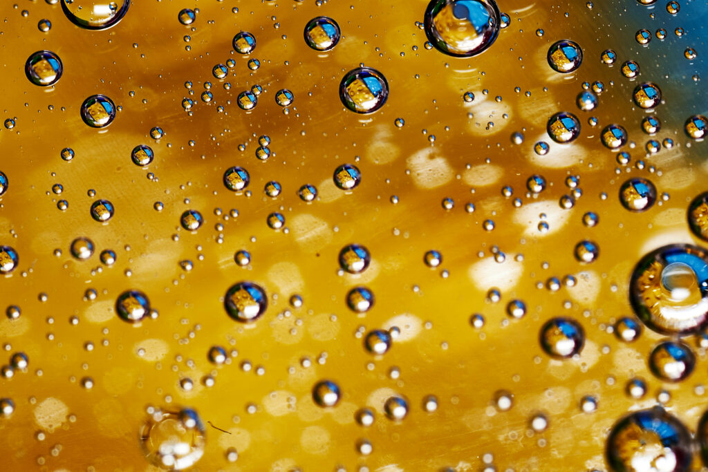 Stunning Macro Wallpaper: Bubbles in Golden Brown Liquid Background