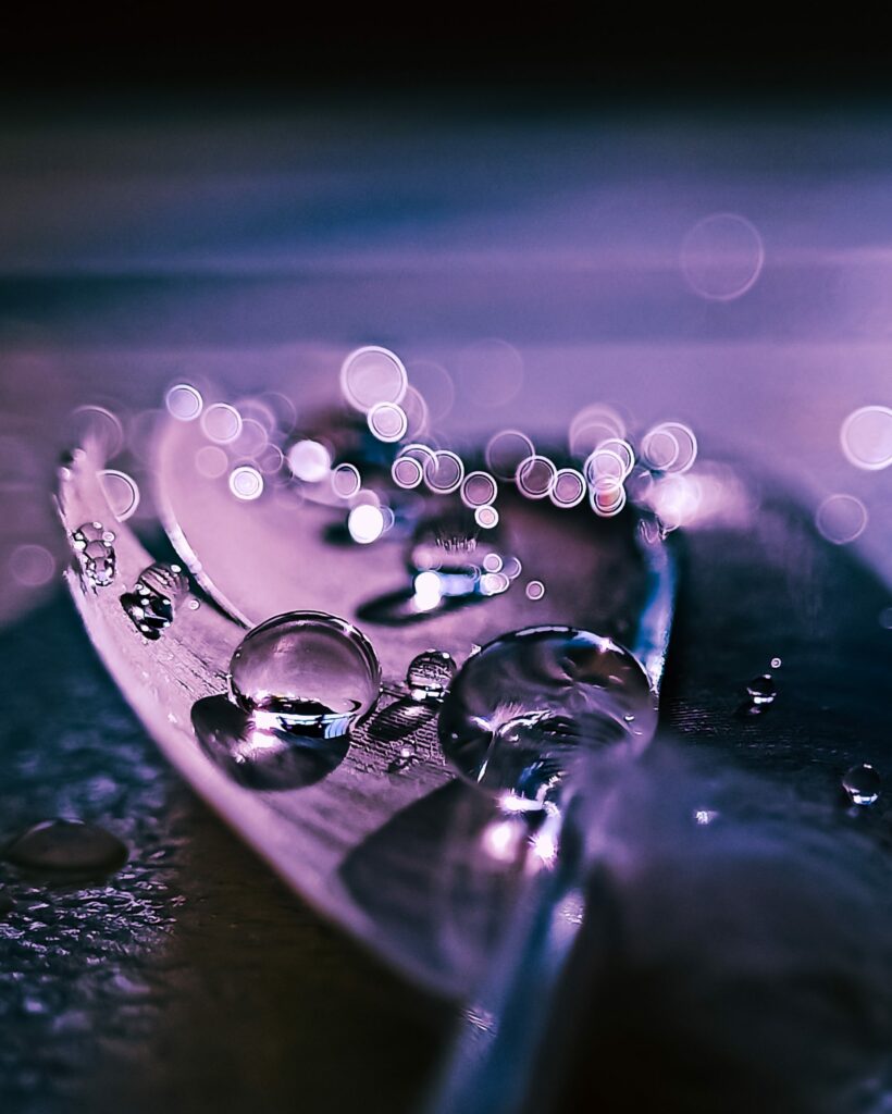 Stunning Macro Wallpaper: Water Drops on Feather with Vibrant Bokeh