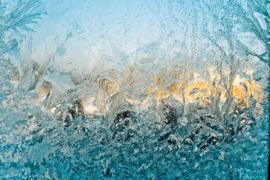 Stunning Macro Frost Patterns Wallpaper with Warm Glow Background