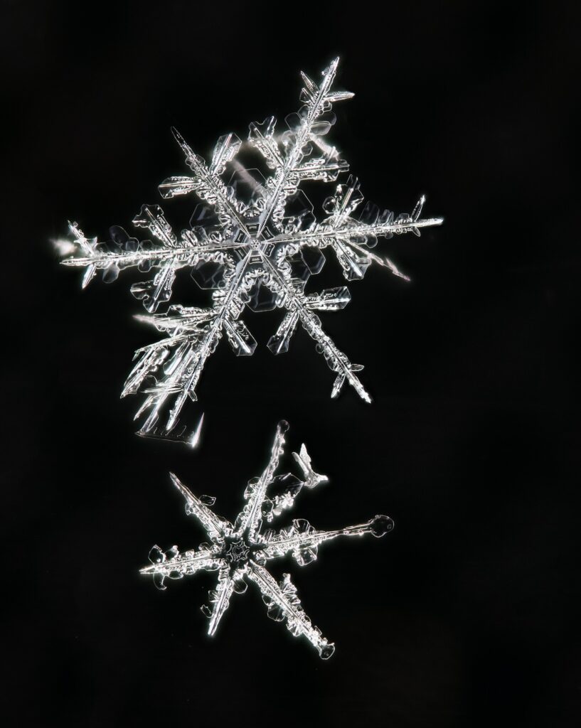 Stunning Snowflake Wallpaper: Intricate Macro Patterns on Dark Background
