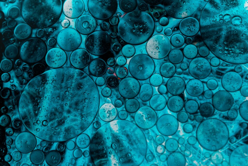 Vibrant Blue Oil Bubbles: Stunning Macro Wallpaper Background