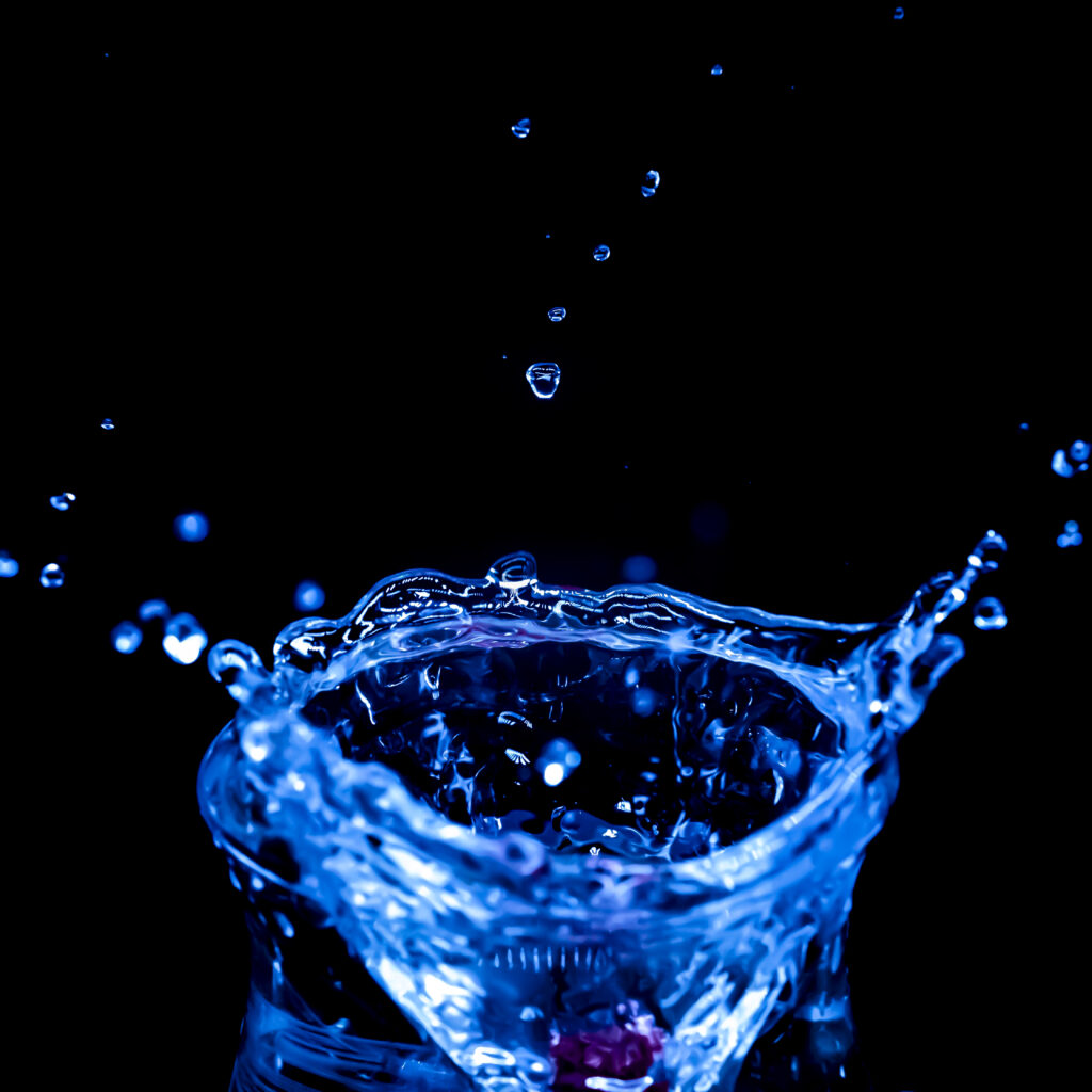 Vibrant Blue Water Splash Macro Wallpaper Background