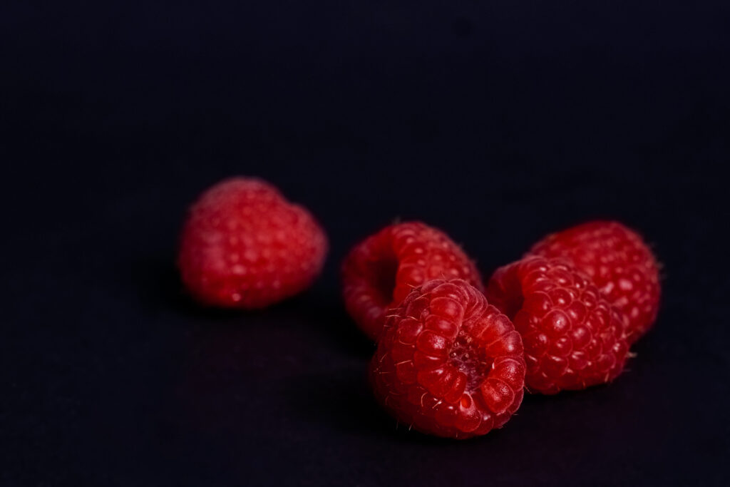 Vibrant Red Raspberries Macro Shot Wallpaper Background
