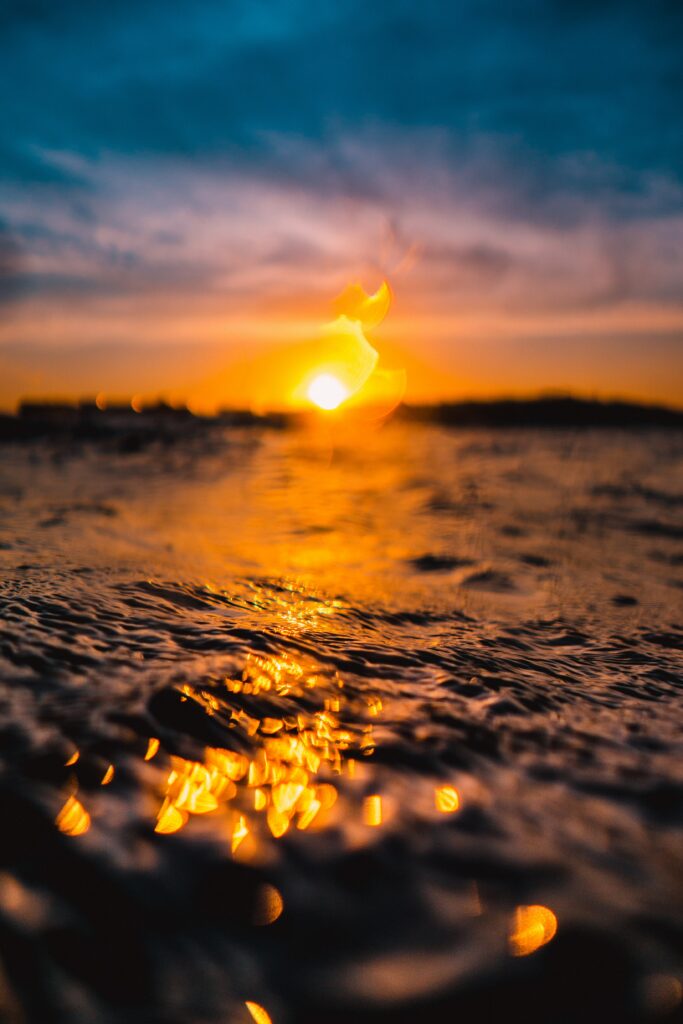 Stunning Macro Sunset Reflection on Water - Serene Wallpaper Background