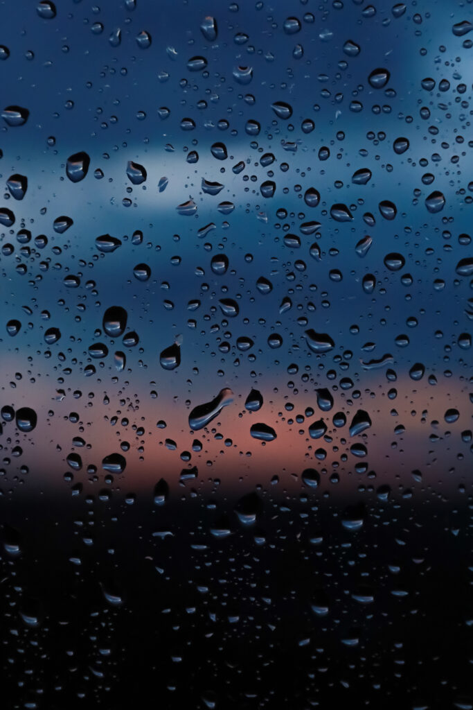 Stunning Macro Wallpaper: Water Droplets on Glass with Sunset Gradient