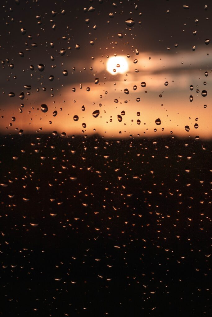 Stunning Macro Wallpaper: Water Droplets & Sunset Glow Background