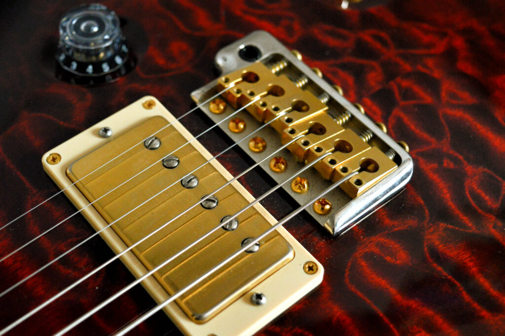 Close-Up Guitar Wallpaper: Strings, Bridge & Fiery Body Details