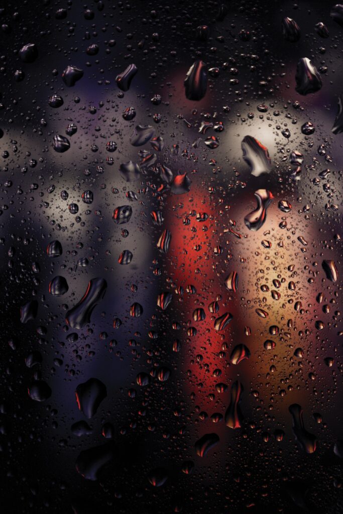 Macro Water Droplets on Glass with Colorful Blurred Lights Wallpaper