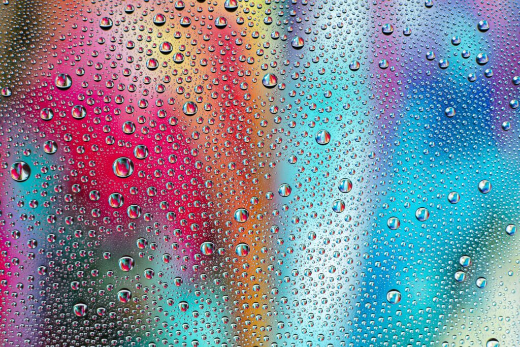 Vibrant Macro Water Drops on Colorful Gradient Background - 6000x4000 Wallpaper