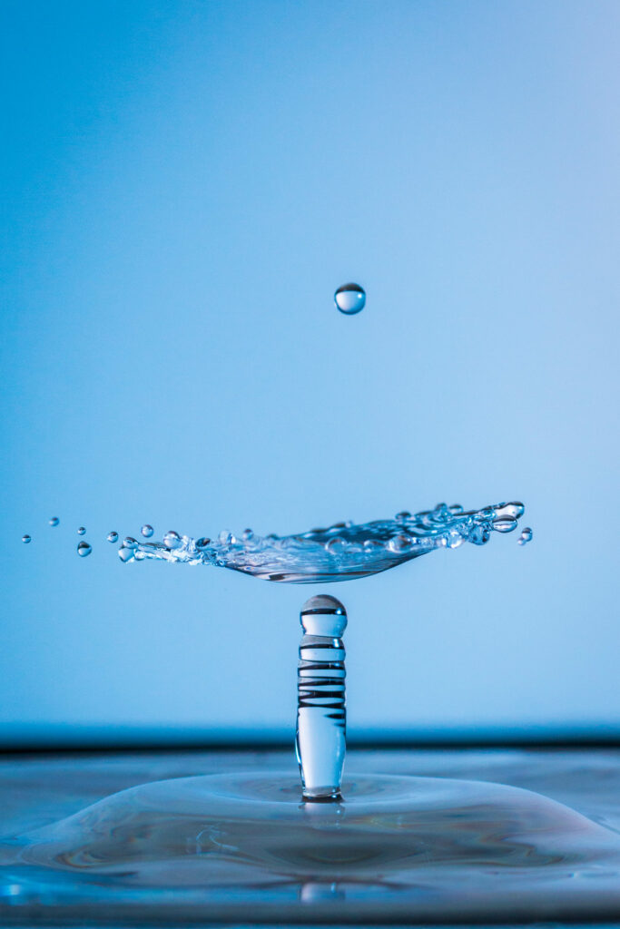 Stunning Macro Water Splash Wallpaper: Intricate Details in Blue