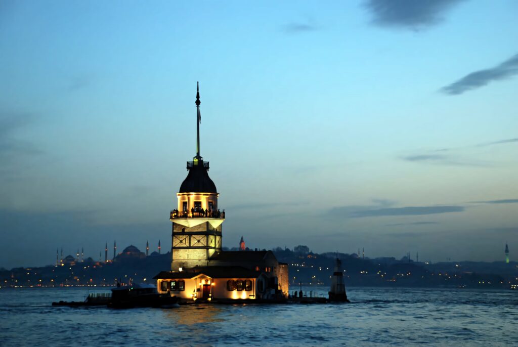 Maiden Tower Wallpaper: Serene Sunset & Calm Waters Background