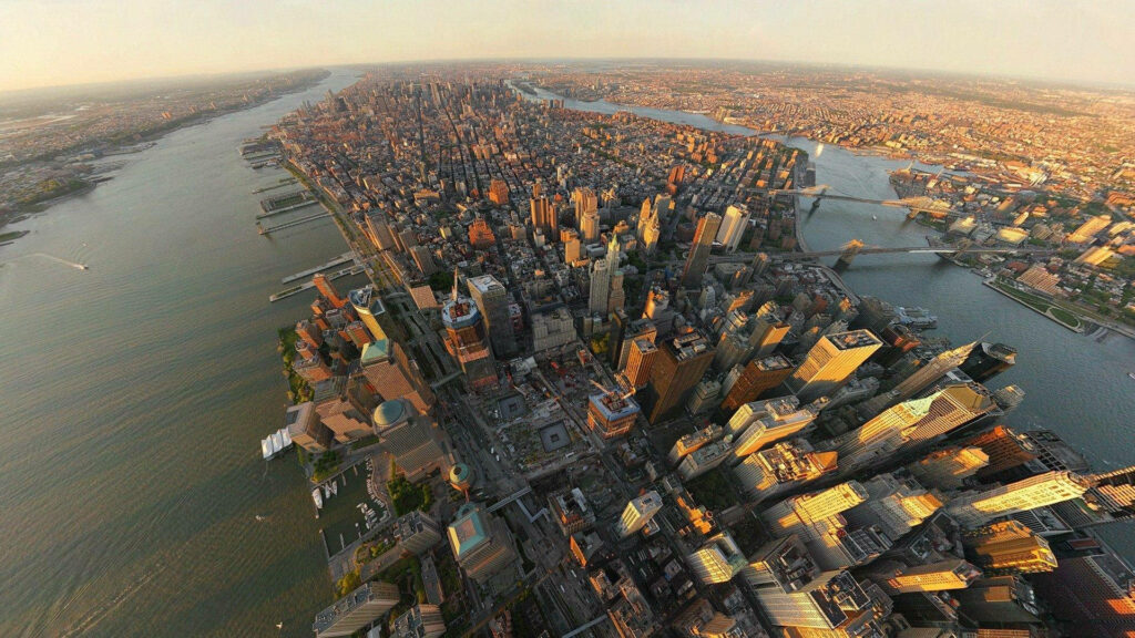 Stunning Aerial Manhattan Skyline Wallpaper: Urban Beauty & Sunlight