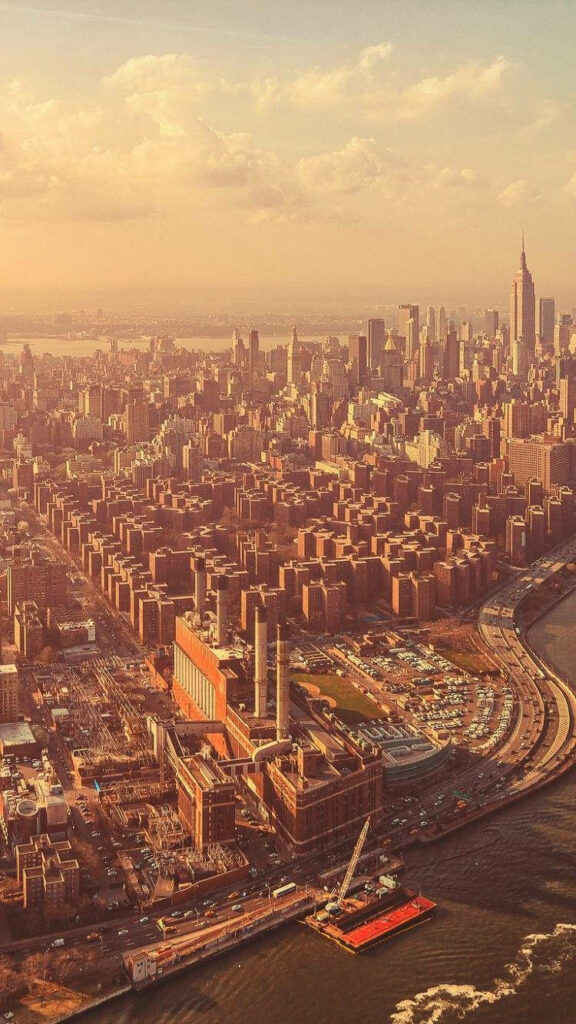 Stunning Manhattan Aerial View Wallpaper: Iconic Skyscrapers & Golden Sky
