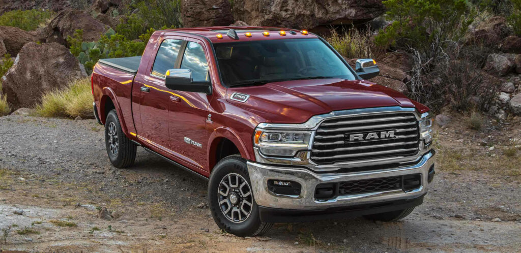 Stunning Maroon RAM 2500 Truck Wallpaper in Rugged Outdoor Setting